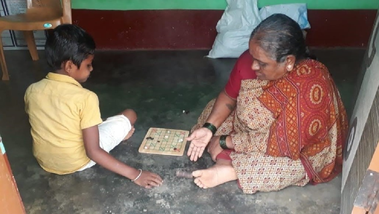 Playing board games with the family members