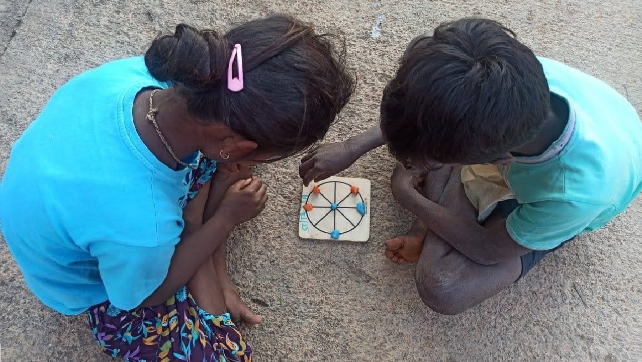Children enjoying a game of Tic-Tac-Toe